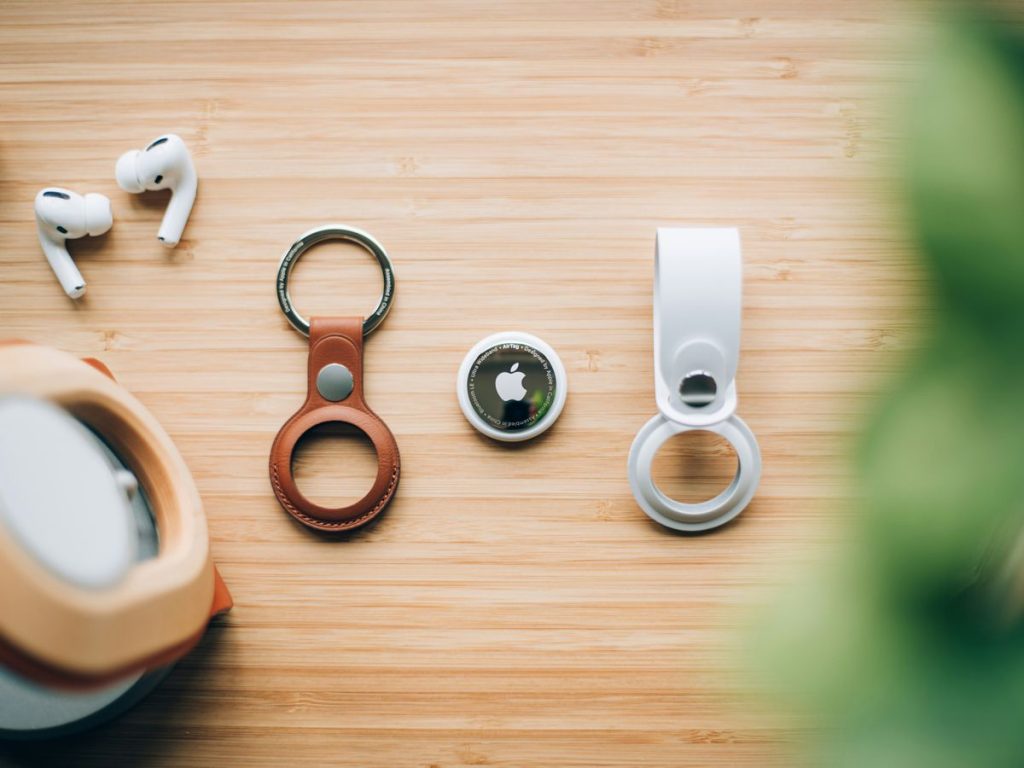 white and orange magnifying glass on brown wooden table