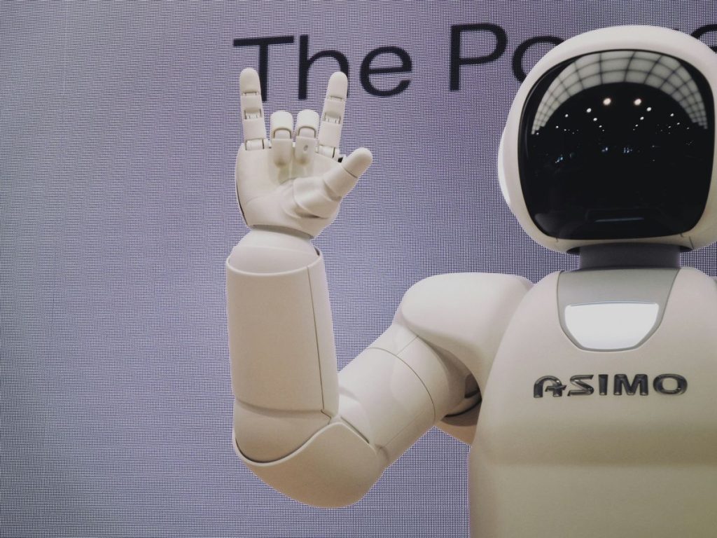 Asimo robot doing handsign