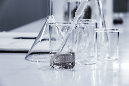 beakers with liquid; scientific advisor
