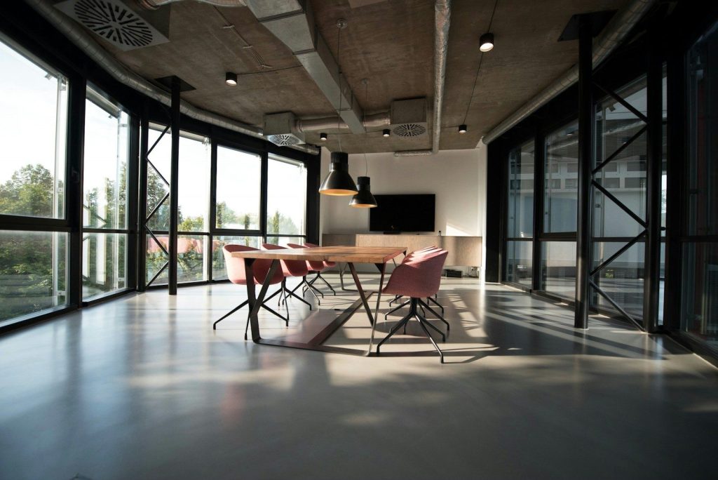 photo of dining table and chairs inside room; modern office