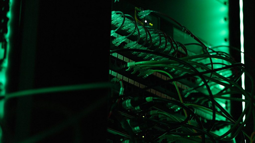 a close up of a rack of computer equipment; FedRAMP-ready hardened container images