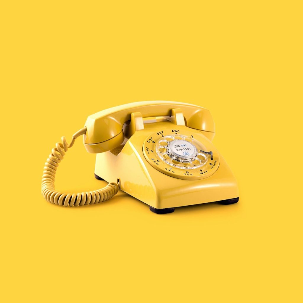 yellow rotary telephone; 833 area code
