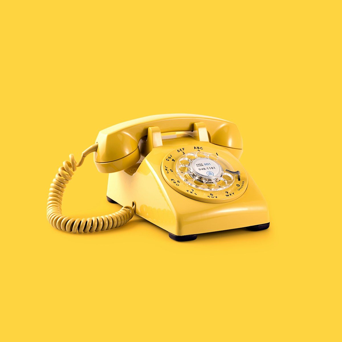 yellow rotary telephone; 833 area code