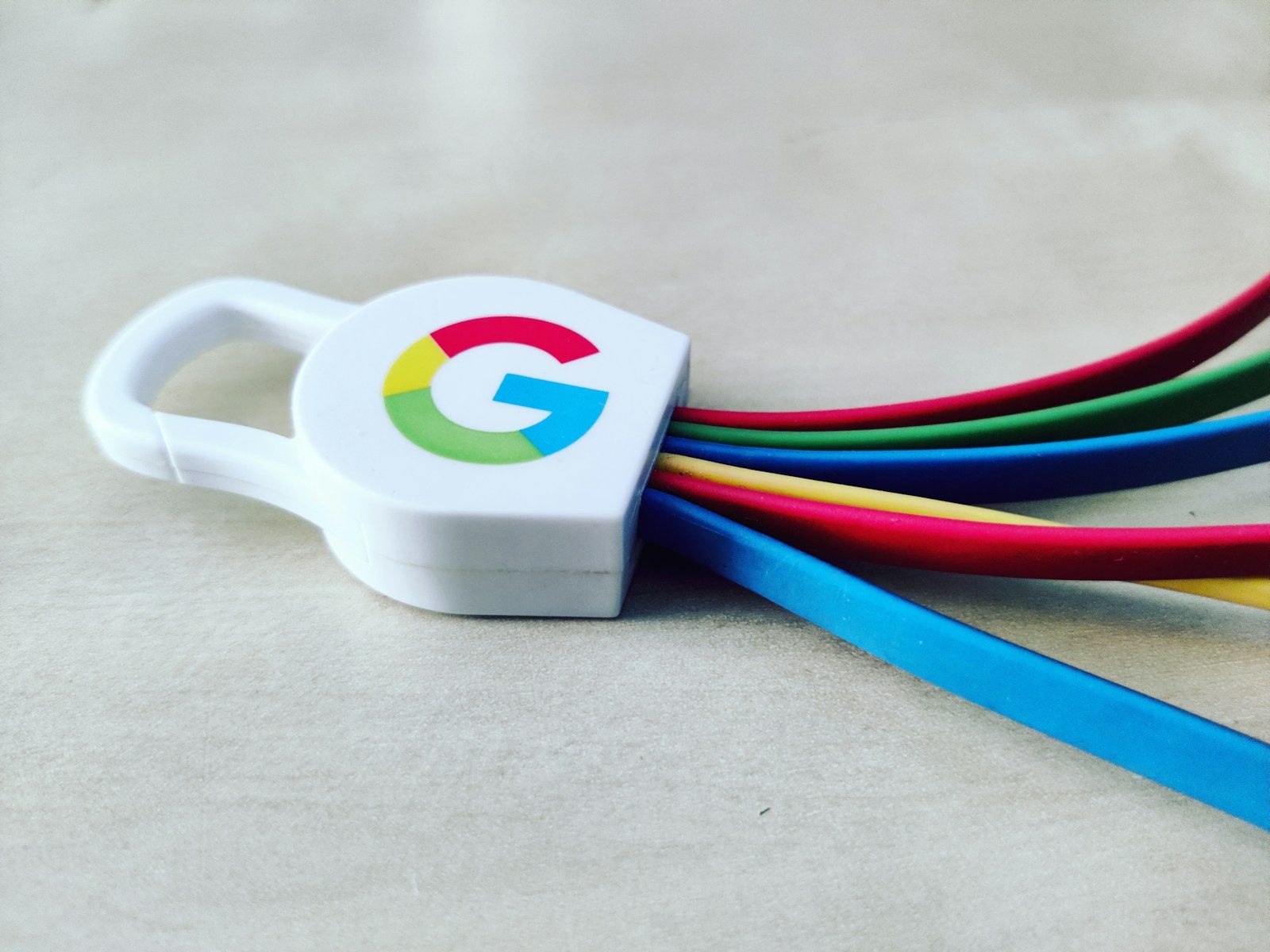 a white and blue cup with a logo on it; Google's Gemini