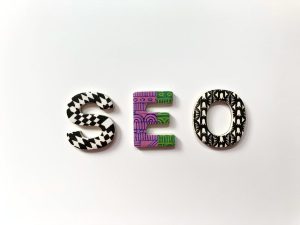 The letters S, E, and O with patterned surfaces on a white background; SEO APis