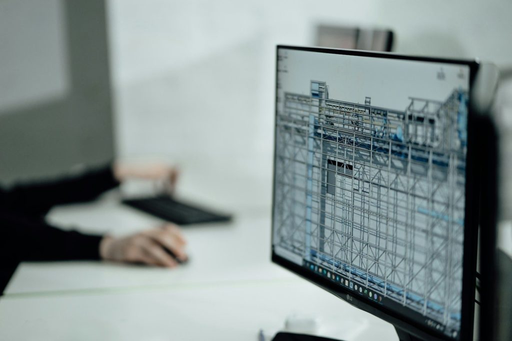 person at desk viewing monitor; prop firm platform architecture