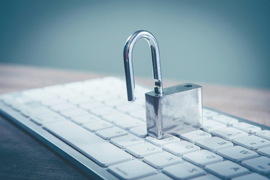 a padlock sitting on top of a computer keyboard; API security platform