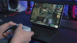 someone gaming on a cheap gaming laptop