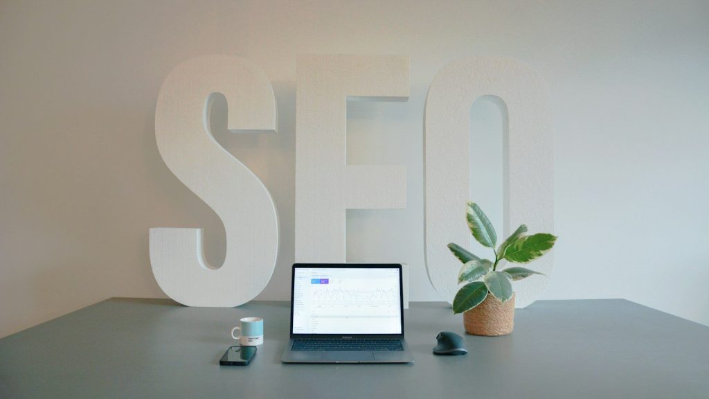 a laptop computer sitting on top of a desk; mass tort SEO