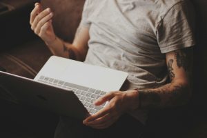 person white laptop computer; PolyBuzz AI