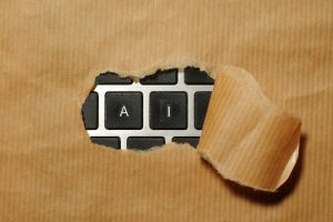 A piece of cardboard with a keyboard appearing through it; AI checker